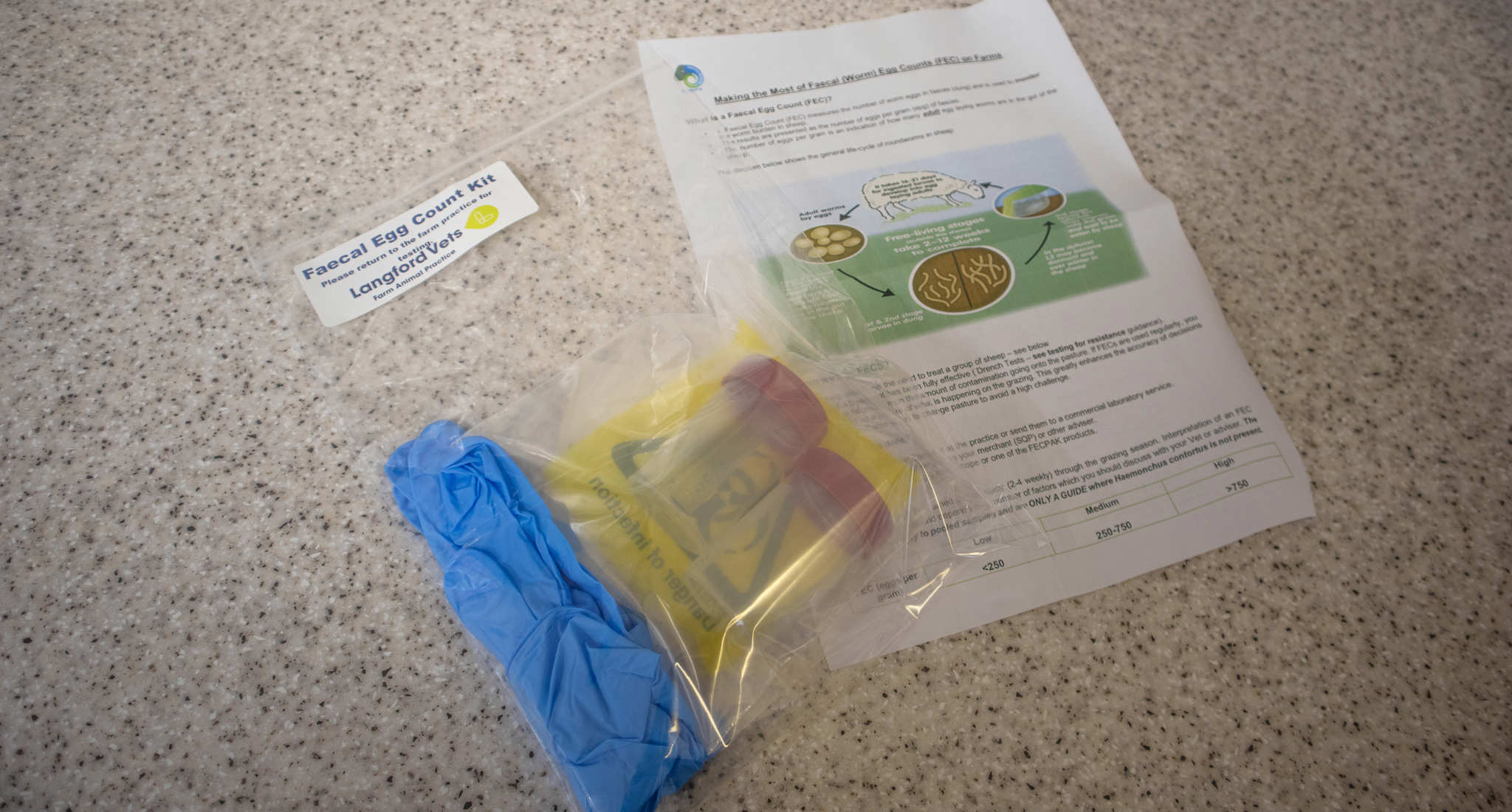 Worm egg count pack containing gloves, instructions and pots for farm animals